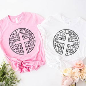 two t - shirts with a cross on the front and a cross on the back