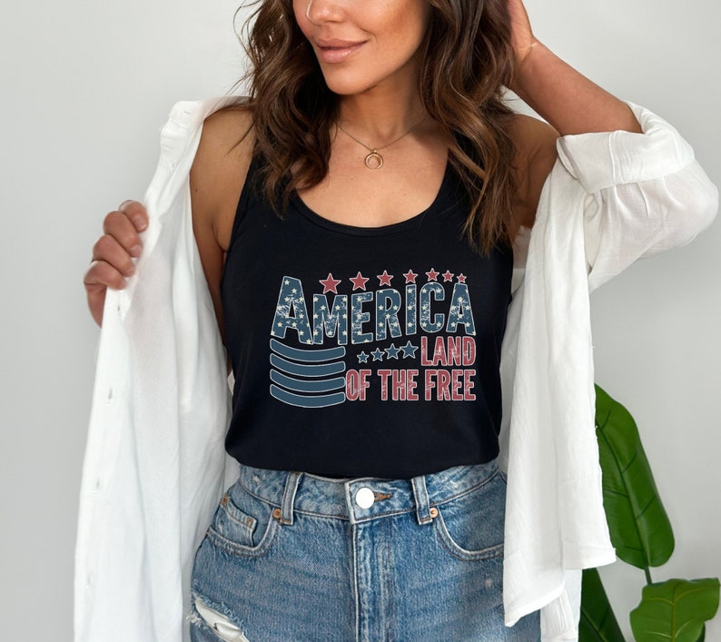 a woman wearing a tank top that says america land of the free