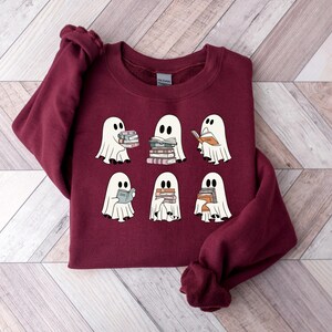 a red shirt with ghost pictures on it