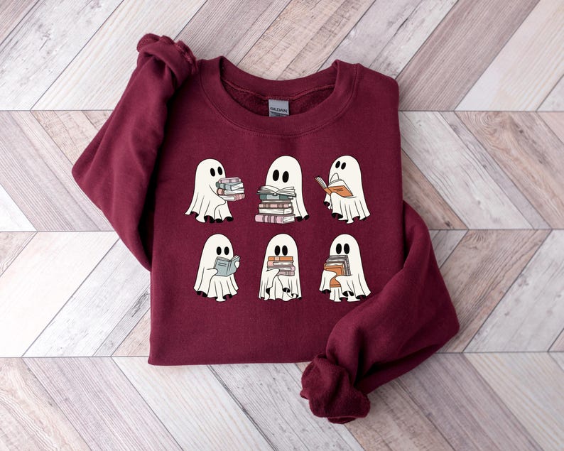 a red shirt with ghost pictures on it