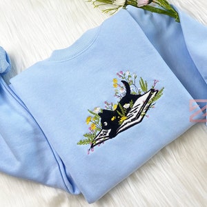 Cute Cat Lying On Book With Flower Embroidered Sweatshirt | Flower With Cat Embroidered Hoodie | Book Lover T-shirt | Crew Neck Sweatshirt