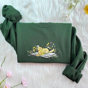 Embroidered Dog Sweatshirt, Lying On Book With Flowers, Book Lover Hoodie