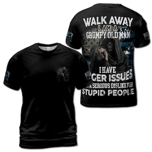 May include: Black t-shirt with a graphic of a grim reaper with a blue and white American flag background. The text on the shirt reads "Walk Away I Am A Grumpy Old Man I Have Anger Issues A Serious Dislike For Stupid People".