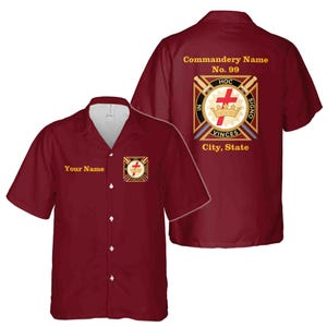 May include: Burgundy short-sleeved shirt with a white collar and buttons. The front of the shirt has a small emblem and the text "Your Name". The back of the shirt features a larger emblem with text, including "Commandery Name No. 99".