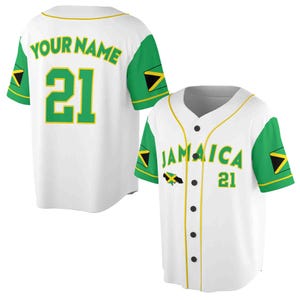 May include: White baseball jersey with green and yellow accents. The jersey has the words "YOUR NAME" and the number "21" on the back. The front of the jersey has the word "JAMAICA" and the number "21" on it. The jersey has a Jamaican flag design on the sleeves.