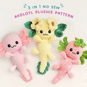 Peut inclure: Trois peluches axolotl en crochet de couleur rose, jaune et rose avec des feuilles vertes. L'axolotl jaune a un tournesol sur la tête. Les axolotls roses ont une fraise et un design uni. Le texte "3 IN 1 NO SEW AXOlotl PLUSHIE PATTERN" est en haut de l'image.