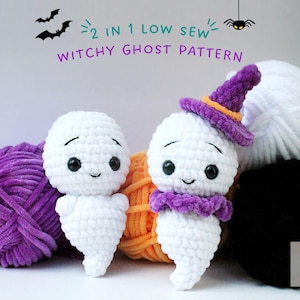 May include: Two crocheted ghost amigurumi toys, one wearing a purple witch hat. The ghosts are white with black eyes and a smiling mouth. The toys are surrounded by balls of yarn in purple, orange, white and black.
