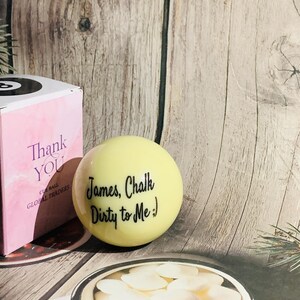 May include: A yellow cue ball with the text "James, Chalk Dirty to Me :)" written on it.