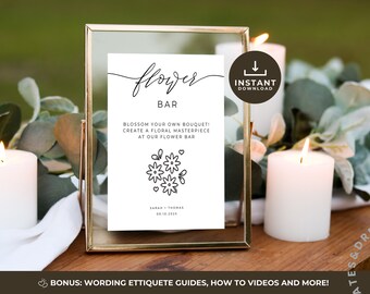 May include: A printable sign for a flower bar at a wedding or other event. The sign is white with black text and a simple line drawing of flowers. The text reads "flower bar" and "blossom your own bouquet! create a floral masterpiece at our flower bar".