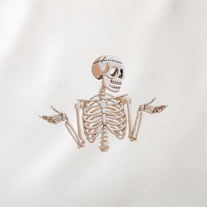 May include: An embroidered skeleton illustration with a stitched head and open hands, set against a white background. The skeleton's rib cage and arms are visible, creating a humorous and spooky design.