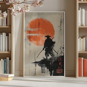May include: A black and white illustration of a samurai standing in front of a large orange sun with a Japanese phrase written in black below the figure. The background is a light gray with a subtle brushstroke effect.