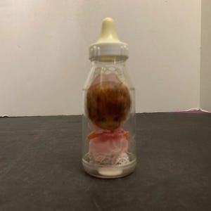 Vintage 3 inch Baby Doll in Plastic Baby Bottle