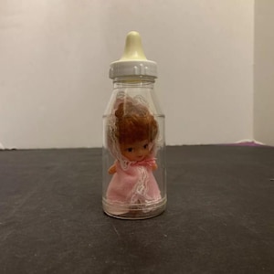 Vintage 3 inch Baby Doll with Pink Dress in Plastic Baby Bottle