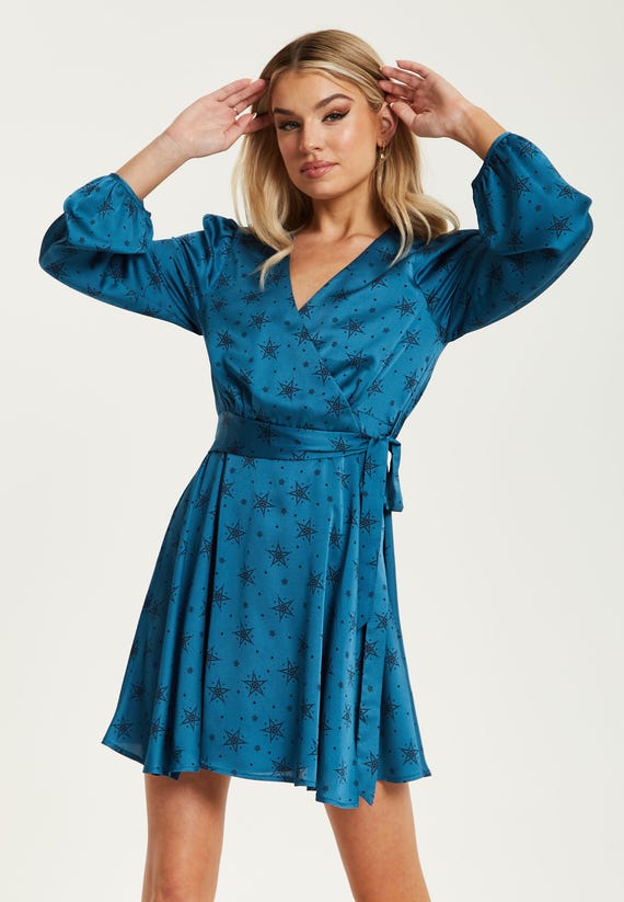 Women's Mini Dress in Petrol Blue with Long Sleeves, Black Star and Polka Dot Print Wrap Style by Liquorish Women's Mini Dress in Petrol Blue with Long Sleeves, Black Star and Polka Dot Print Wrap Style by Liquorish