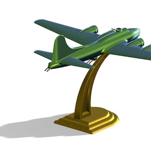 Peut inclure: Un modèle d'avion vert sur un support doré. L'avion est un bombardier B-17, un type d'avion utilisé pendant la Seconde Guerre mondiale.