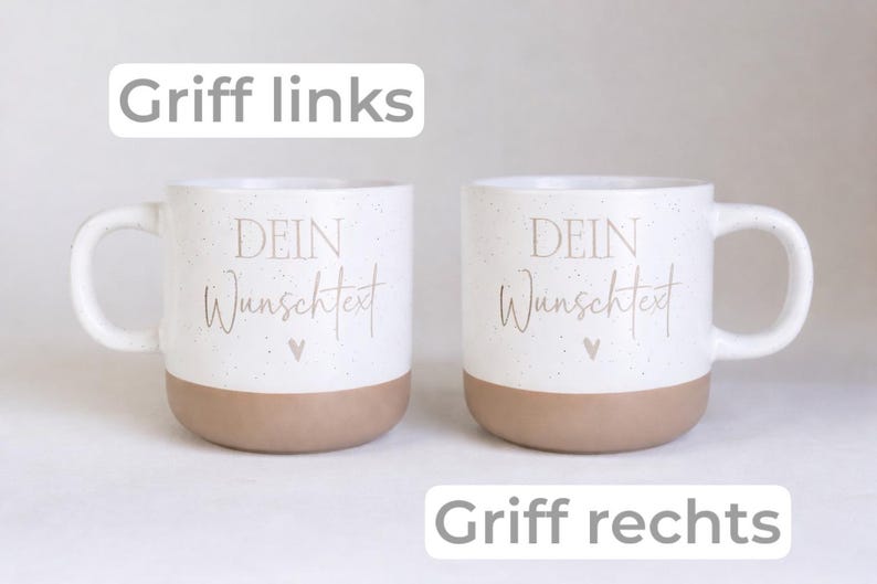 May include: Two white ceramic mugs with speckled details and a tan base. Each mug features the text "DEIN Wunschtext" and a small heart icon. One mug has a handle on the left, and the other has a handle on the right. The text "Griff links" and "Griff rechts" appear above and below the mugs.