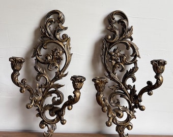 Par de apliques de pared grandes, vintage, ornamentados, dorados y negros, con doble brazo para velas.