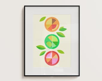 May include: A framed print with a geometric design of three fruit slices. The fruit slices are orange, green, and pink, and they are arranged in a vertical stack. The background is a light cream color.