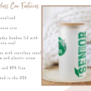 a white can with green lettering and a straw in it