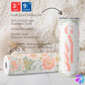 May include: A stainless steel tumbler with a floral pattern and the word "GAMMY" in pink lettering. The tumbler is double-walled and has a leak-proof sliding lid. It keeps drinks hot for 3 hours and cold for 9 hours. A straw is included.