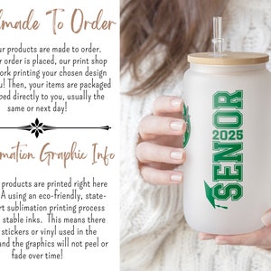 a woman holding a white coffee cup with green lettering