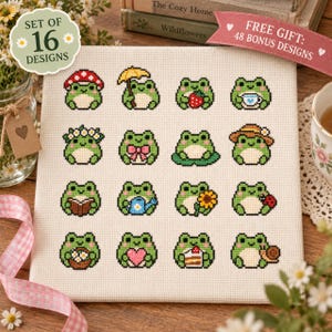 May include: A cross-stitch pattern on white fabric featuring a grid of 16 green frog designs. Each frog is depicted with different accessories including a mushroom cap, umbrella, strawberry, teacup, flower crown, bow, hat, book, watering can, sunflower, ladybug, basket, heart, cake, and snail.