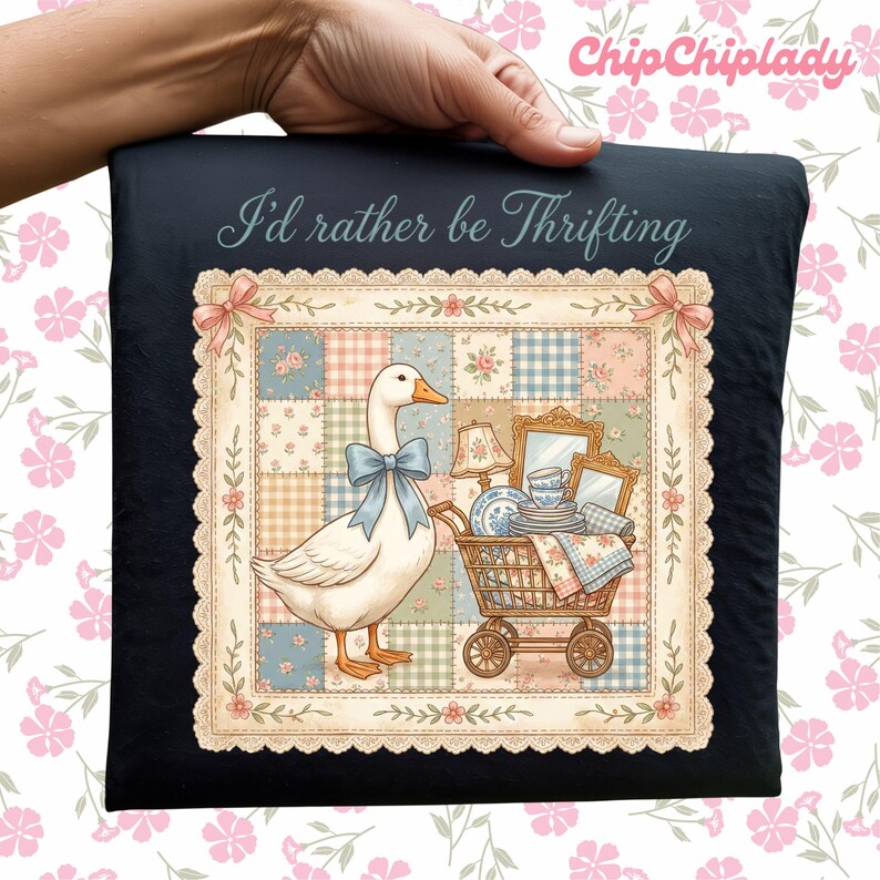 May include: Black pillow with a whimsical illustration featuring a white goose wearing a blue bow, a shopping cart filled with dishes, and the text "I'd rather be Thrifting". The image has a patchwork quilt design.
