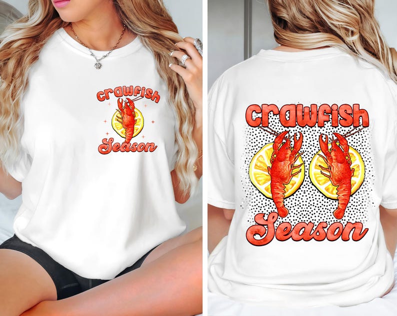 May include: White t-shirt with a red crawfish and lemon design. The text "crawfish season" is printed in red on the front and back of the shirt.