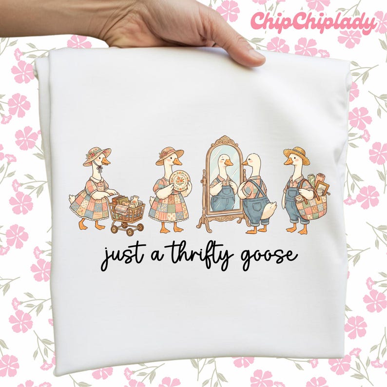 May include: White t-shirt featuring a whimsical illustration of geese dressed in vintage clothing. The geese are depicted in various scenarios, including shopping and admiring themselves in a mirror. The text "just a thrifty goose" is written below the illustration.