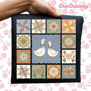 May include: Black square pillow featuring a patchwork design with floral and geometric patterns in pastel colors. The center square has two white ducks with blue bows. The pillow is held by a hand, with the text "ChipChipLady" in the upper right corner.