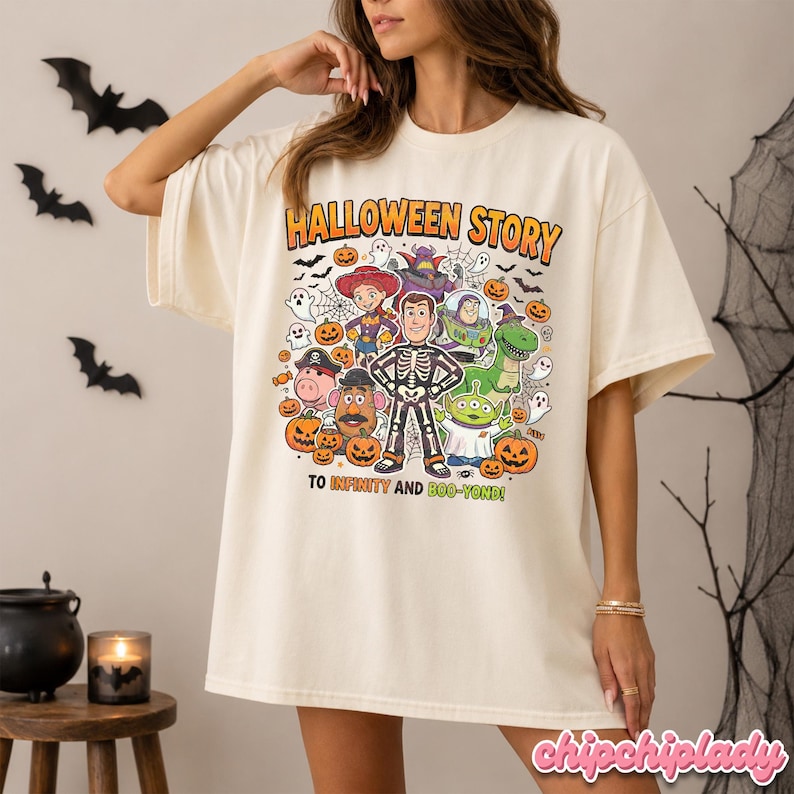 May include: Cream-colored t-shirt with a Halloween-themed graphic. The design features characters from Toy Story, pumpkins, ghosts, and the text "HALLOWEEN STORY" and "TO INFINITY AND BOO-YOND!"