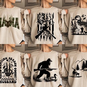 Op de afbeelding: Zes verschillende ontwerpen van beige sweatshirts met zwarte grafische prints. De ontwerpen omvatten een hert met geweien, een eend, een berglandschap, een yeti, een skelethand en het woord "Mama".