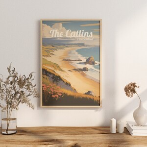 May include: A vintage-style travel poster with a scenic view of a beach in The Catlins, New Zealand. The poster features a sandy beach with turquoise water, green hills, and a rocky outcropping. The text "The Catlins, New Zealand" is printed in a retro font.