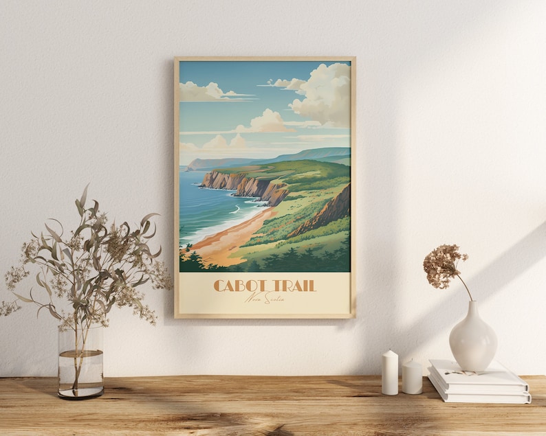 May include: A vintage-style poster featuring a scenic view of a coastline with cliffs and a sandy beach. The poster is titled "Cabot Trail Nova Scotia".