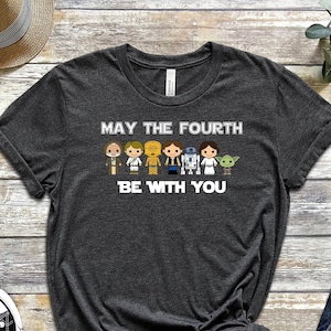 May include: A dark gray t-shirt with a white graphic of Star Wars characters and the text "May the Fourth Be With You".