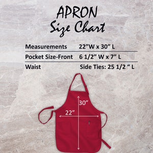May include: Red apron with a large pocket on the front. The apron measures 22 inches wide by 30 inches long. The pocket measures 6 1/2 inches wide by 7 inches long. The apron has 25 1/2 inch long ties.