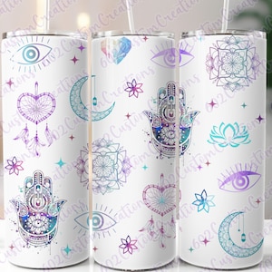 May include: Three white tumblers with a colorful pattern of hamsa hands, dreamcatchers, moons, eyes, and mandalas. The pattern is in shades of purple, blue, and teal.