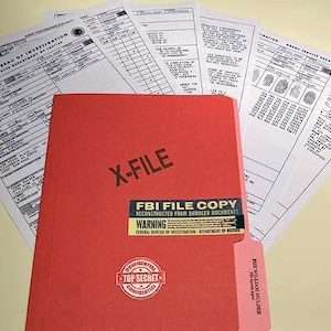 May include: A red file folder labeled "X-FILE" with a sticker that reads "FBI FILE COPY RECONSTRUCTED FROM DAMAGED DOCUMENTS WARNING FEDERAL BUREAU OF INVESTIGATION DEPARTMENT OF JUSTICE". The folder also has a "CONFIDENTIAL TOP SECRET CONFIDENTIAL" stamp.