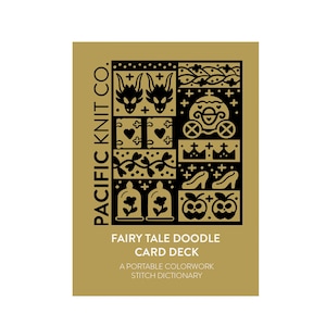 May include: A gold-colored card deck featuring black illustrations of fairy tale elements. The card deck includes images of dragons, hearts, a carriage, crowns, shoes, apples, and bells. The text "FAIRY TALE DOODLE CARD DECK" is also visible.