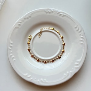 Pulsera de eslabones de cadena con estrellas doradas y plateadas