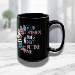May include: Black coffee mug with a sunflower design and the text "YOUR OPINION DOES NOT DEFINE ME".