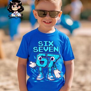 May include: A bright blue t-shirt featuring the text "SIX SEVEN" in a pixelated style. Below, the numbers 6 and 7 are designed as cartoon figures with arms, legs, and smiling faces. The shirt is worn by a child.