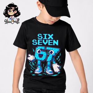 May include: Black t-shirt featuring the words "SIX SEVEN" in a blue pixelated font. Below, the numbers 6 and 7 are depicted as cartoon characters with arms, legs, and shoes. The design includes lightning bolts.