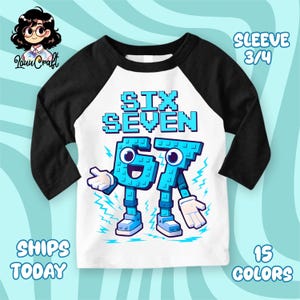 May include: A white and black raglan style shirt with the words "SIX SEVEN" in blue pixelated font. The numbers "6" and "7" are designed as cartoon characters with arms, legs, and shoes. The shirt has 3/4 sleeves.