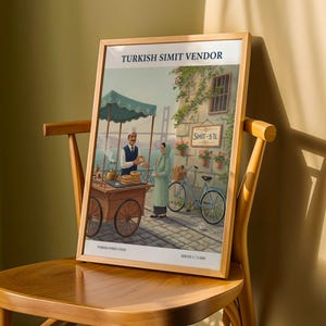 May include: Framed print of a Turkish Simit Vendor scene. The artwork depicts a street food vendor with a cart, a woman in a headscarf, and a bicycle. The text on the print reads "TURKISH SIMIT VENDOR" and "TURKISH STREET FOOD".