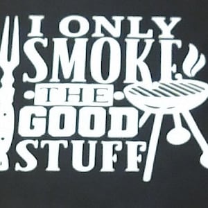 May include: White text on a black background reads "I only smoke the good stuff". A white fork and a white grill with smoke coming out of the top are included in the design.