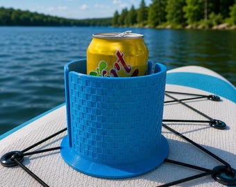 May include: A bright blue cylindrical cup holder with a textured basket-weave pattern on the exterior. The holder is designed to secure a yellow aluminum beverage can and features a vertical slit along one side for flexible placement.