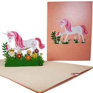 Tarjeta desplegable Unicornio en el campo de margaritas