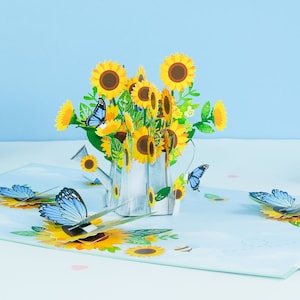 Biglietto pop-up con bouquet di girasoli per annaffiatoio