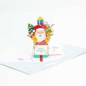 Santa in a Christmas Present Pop-Up Christmas Card